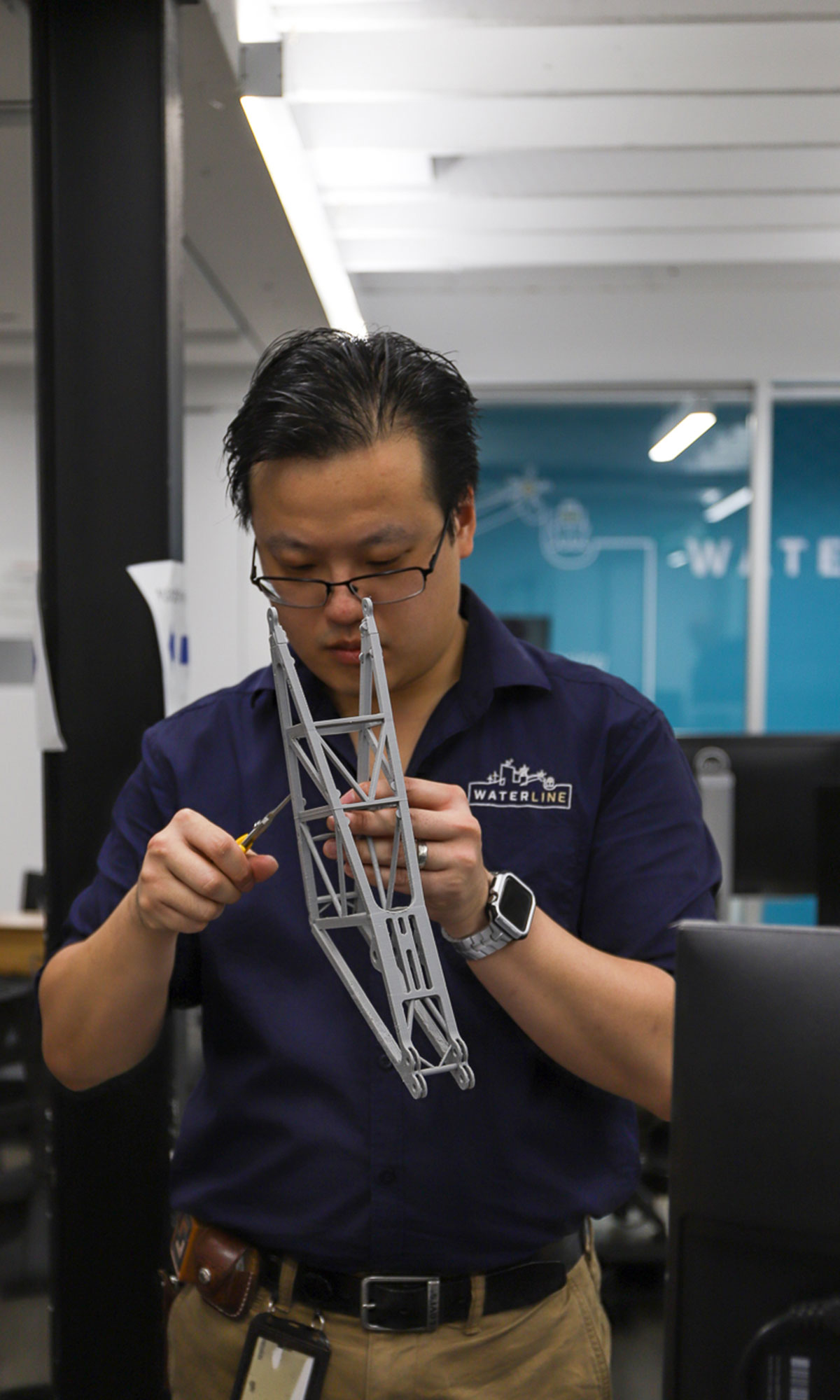 Waterline's Mike Hsu putting some final touches on the 3D print before presenting to BHP