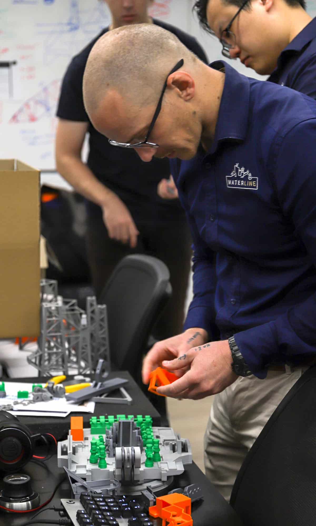 Waterline's Ben Pommee putting some final touches on the 3D print before presenting to BHP