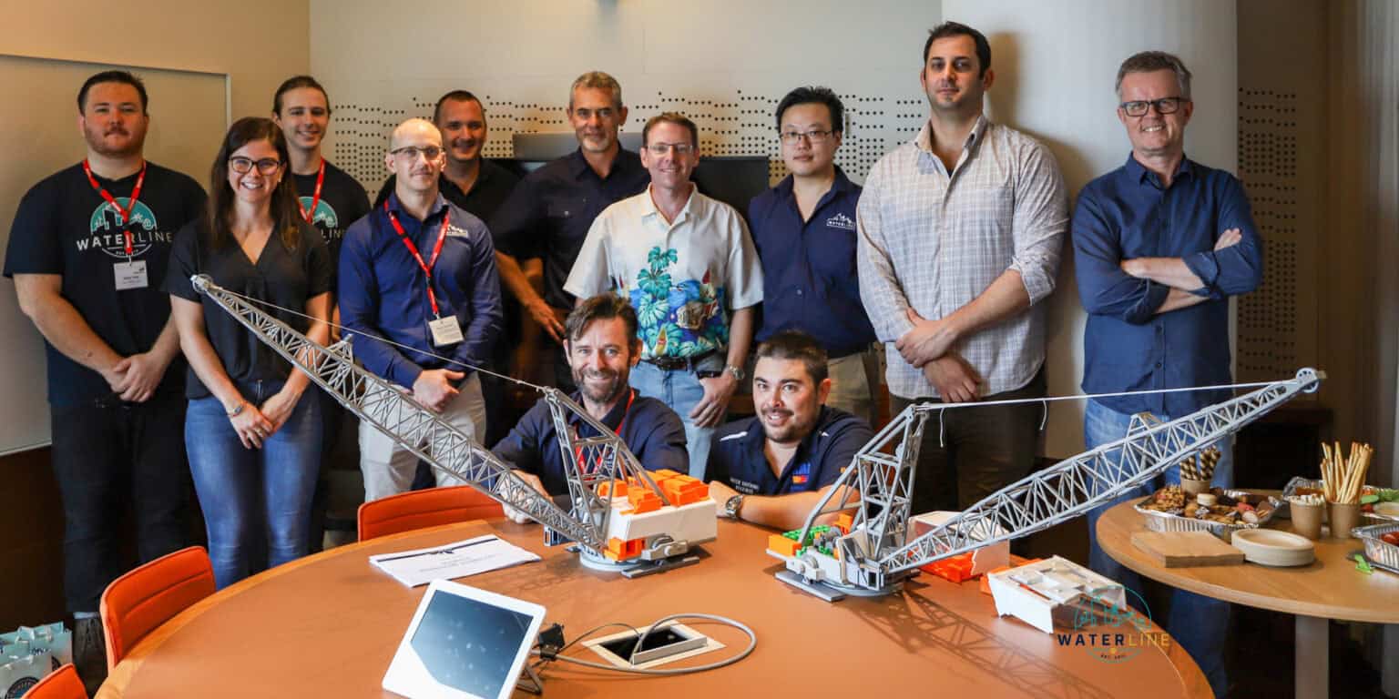 The Waterline and BHP team with the 3D printed dragline, L-R Blair Mohi, Kristin Watkins, Cody Williams, Ben Pomme’e, Julian Van Der Riet, Randall, Johan Vilojen, Marcel Turner, Kim Jeffery, Mike Hsu, Kristian Jadrovski, Peter Warpernius